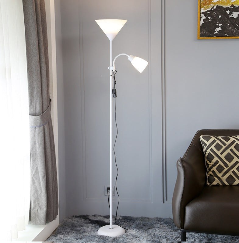 White floor lamp with reading light in a living room setting