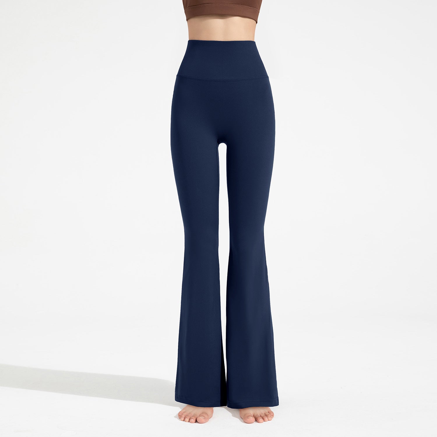 Navy blue flared pants on a white background