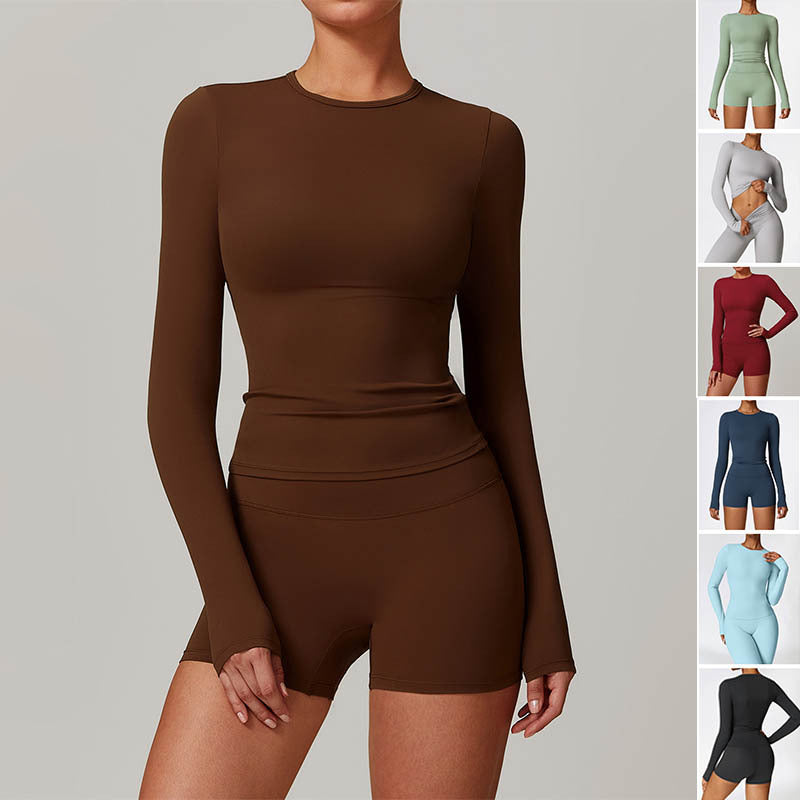 Brown long-sleeve romper worn by a model on a gray background with color swatches of other rompers.