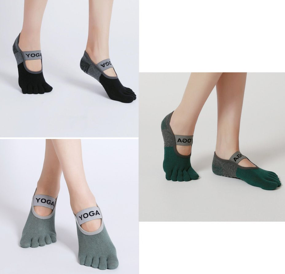 Set of five-toe yoga socks in black and gray on a white background