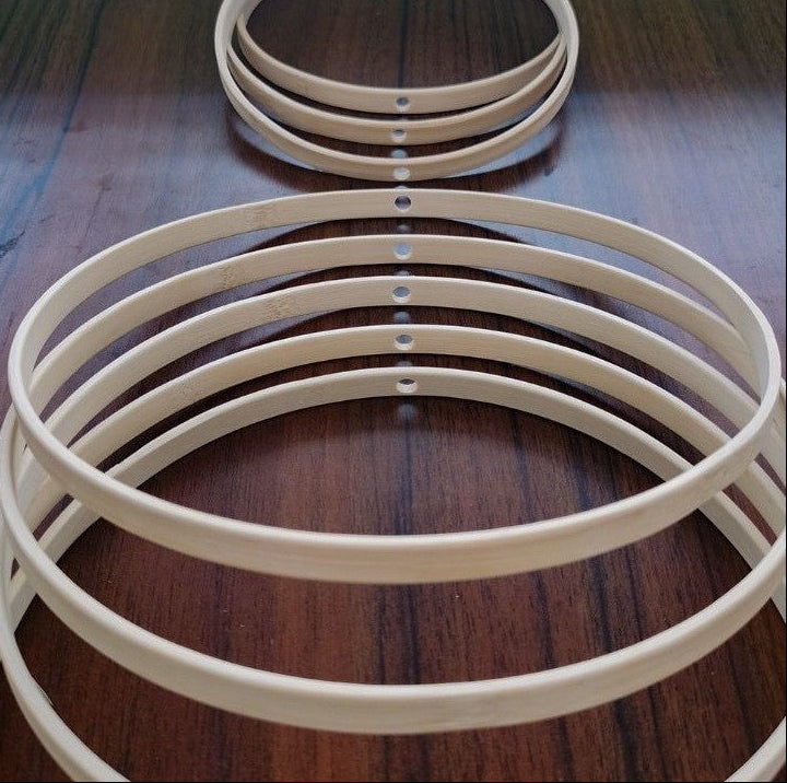 Set of white circular rings on a wooden surface