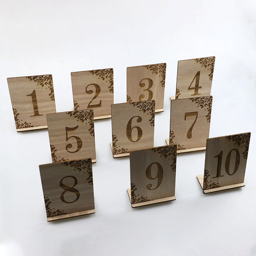 Wooden table number cards from 1 to 10 on a white background