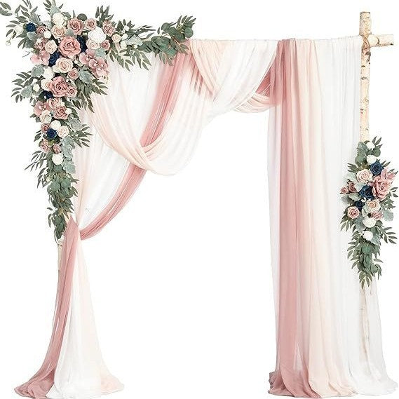 Decorative arch with pink and white drapes and floral arrangements on a white background