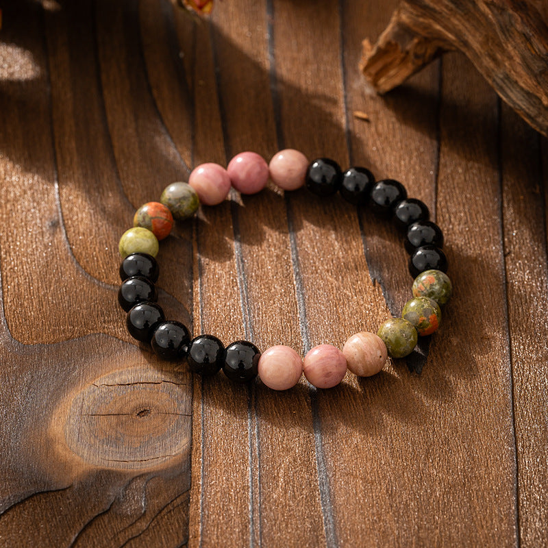 Multicolored beaded bracelet on a wooden surface