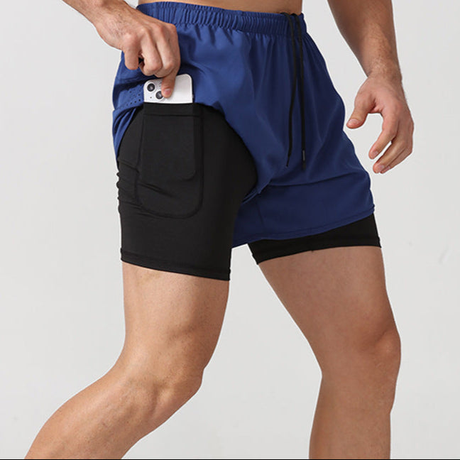 Person wearing a blue and black athletic short with a pocket on a light gray background