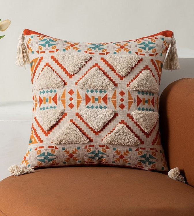Decorative pillow with geometric pattern on a brown chair
