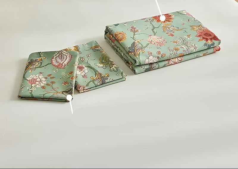 Floral bedding set on a bed with a wicker headboard on a white background