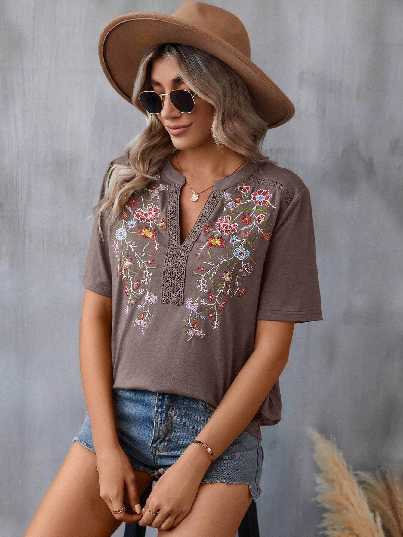 Woman wearing a brown embroidered shirt and hat against a gray background