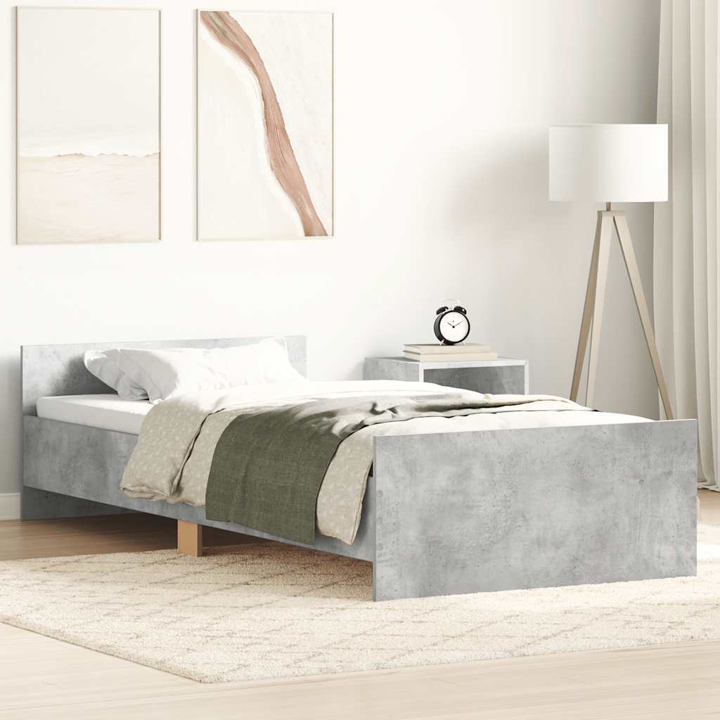 Modern bedroom with a concrete bed frame, white bedding, and minimal decor.