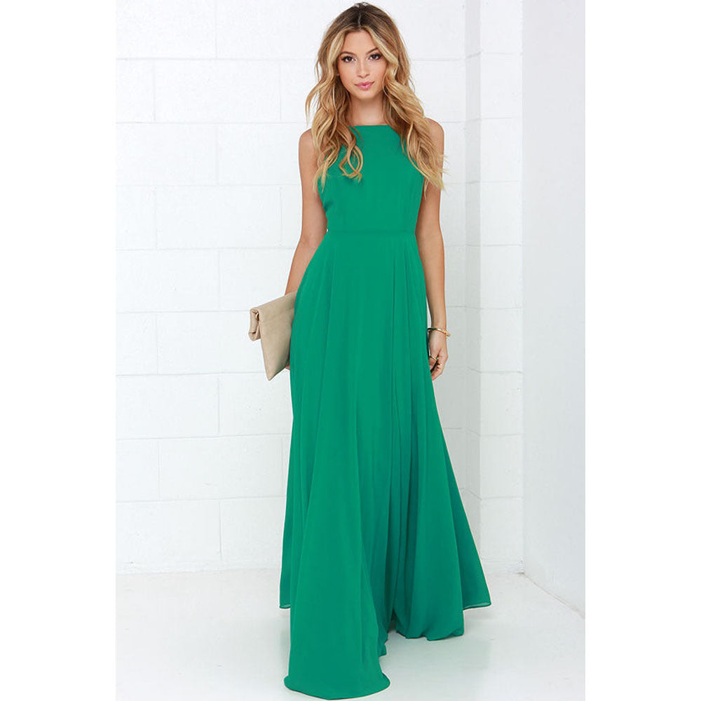 Woman wearing a green dress against a white background