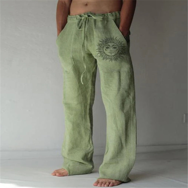 Green pants with a sun design on a plain background