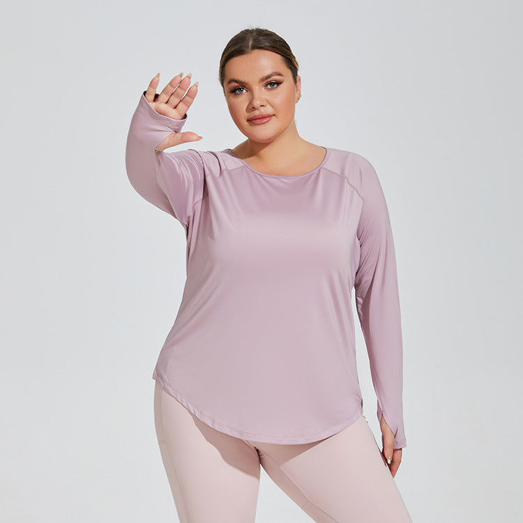 Woman wearing a light purple long-sleeve top and pants on a white background