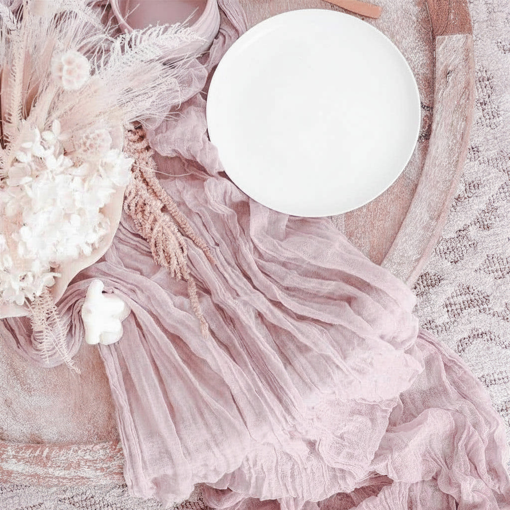 Plate of waffles and a croissant on a textured surface with decorative elements.