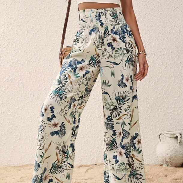 Floral patterned pants worn by a person against a neutral background