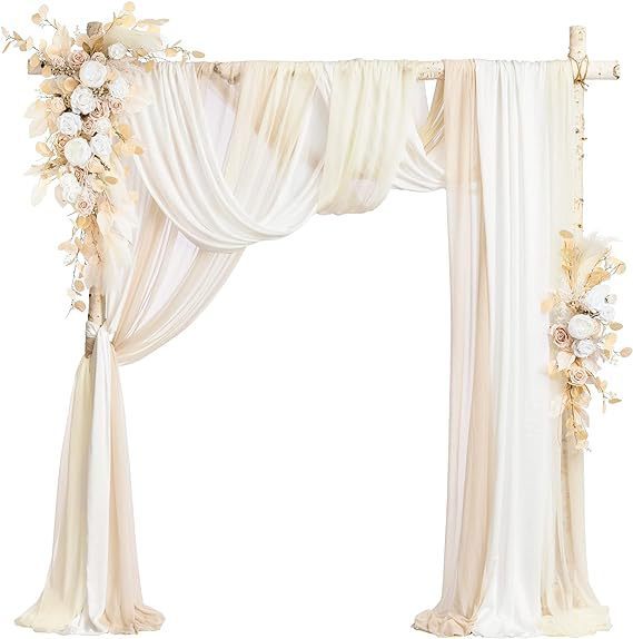 Decorative arch with white drapes and floral arrangements on a white background