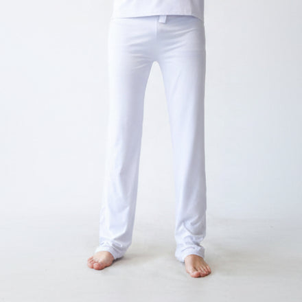 White pants worn by a person on a white background