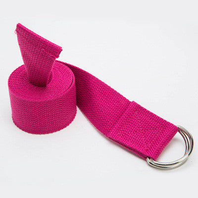 Pink yoga strap with a metal ring on a white background