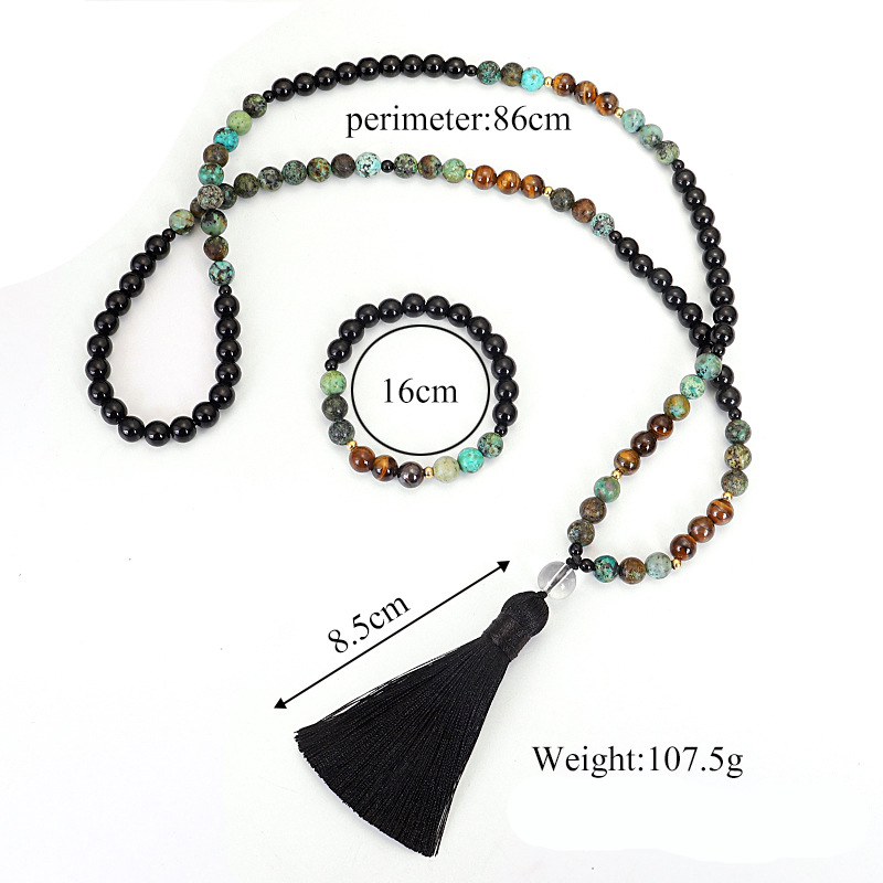 Multicolored beaded necklace with tassel and measurements on a white background