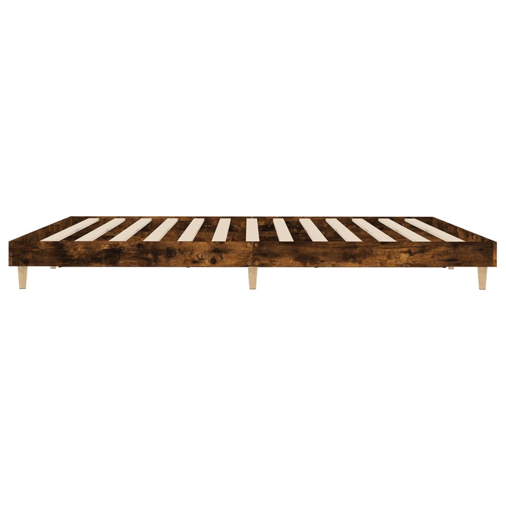 Wooden bed frame with slatted design on a white background