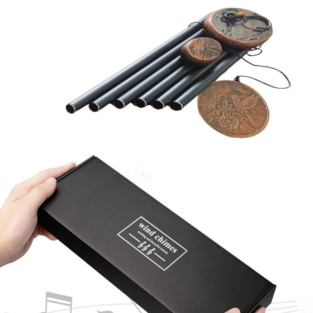 Wind chimes in a black box with festive and family-themed images on a white background.
