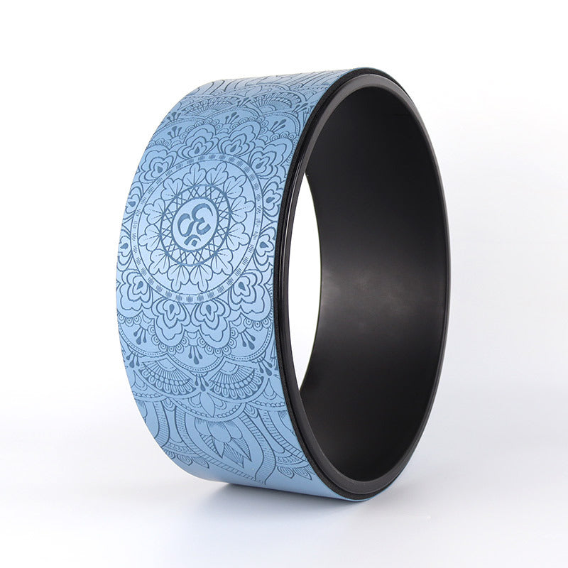 Yoga wheel with blue patterned design on a white background