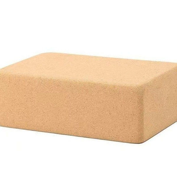 Beige yoga block on a white background