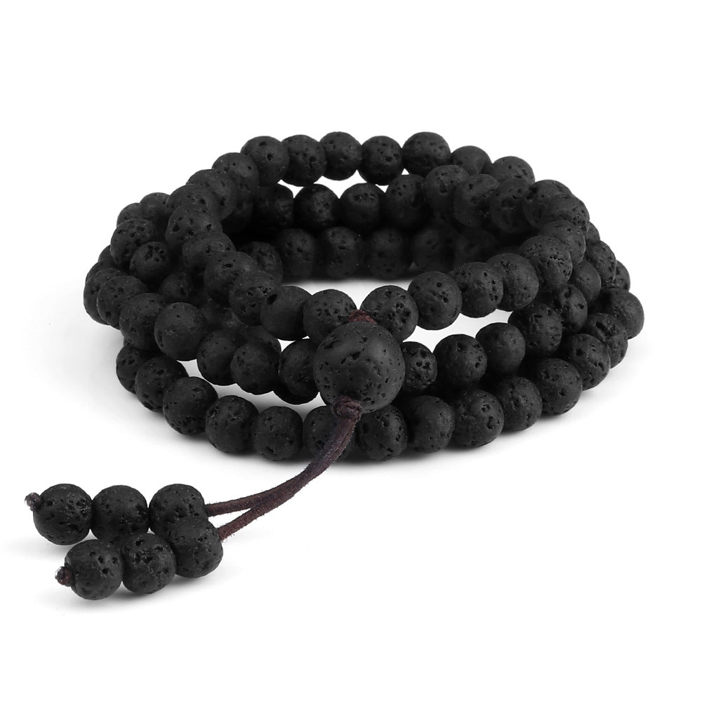 Black lava bead bracelet on a white background