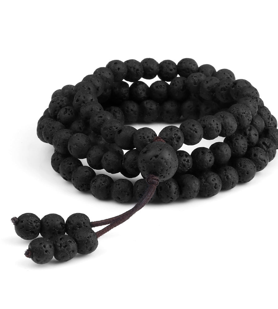 Black lava bead bracelet on a white background