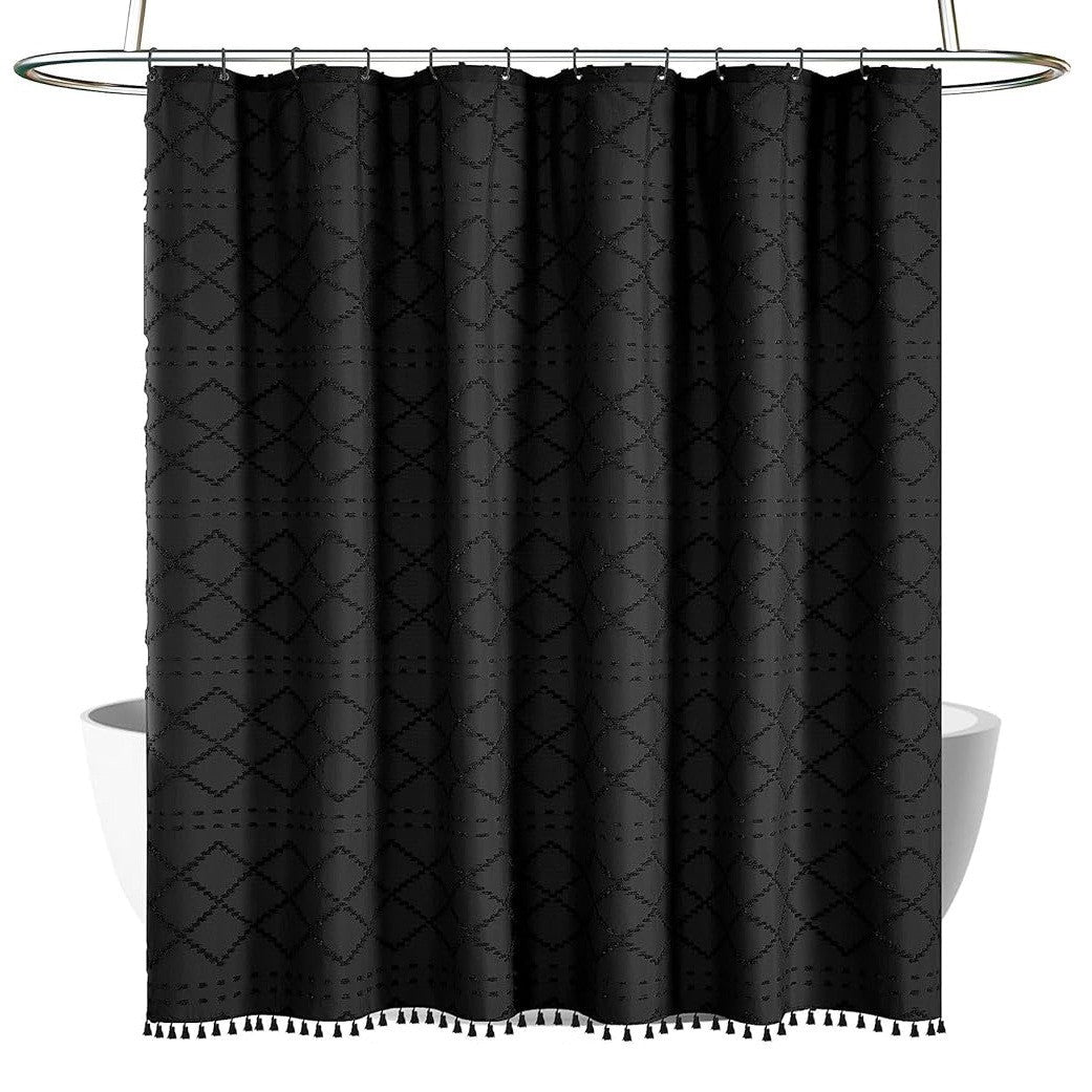 Black geometric patterned shower curtain with tassels on a white background