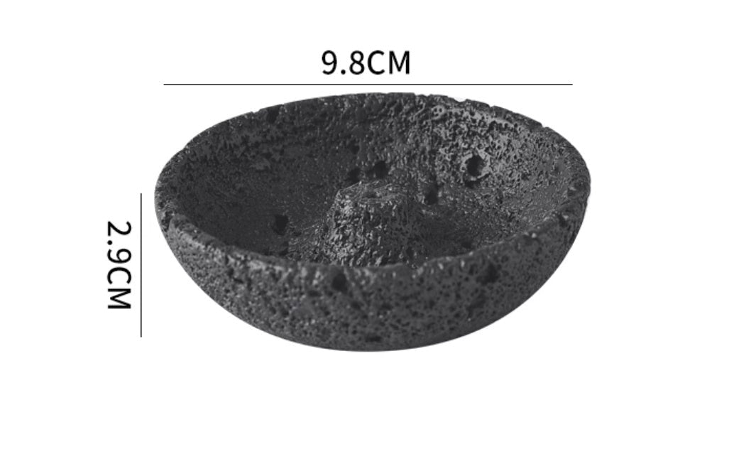 Black volcanic stone bowl with measurements on a white background