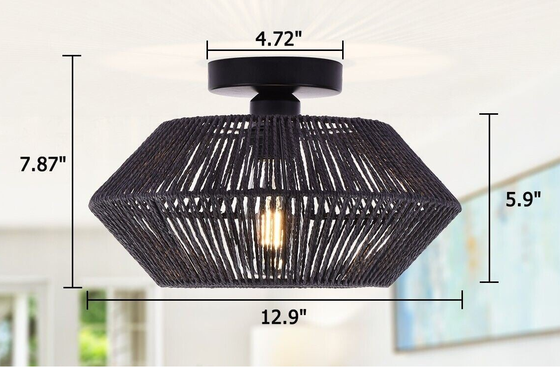Black woven ceiling light fixture with measurements on a blurred background