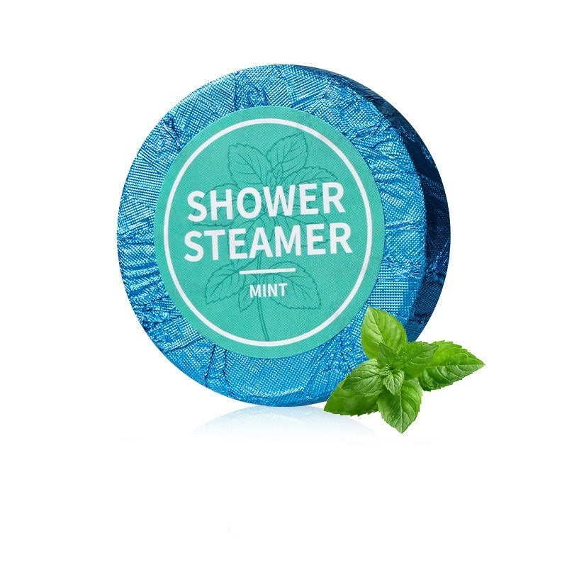Blue shower steamer with mint leaves on a white background