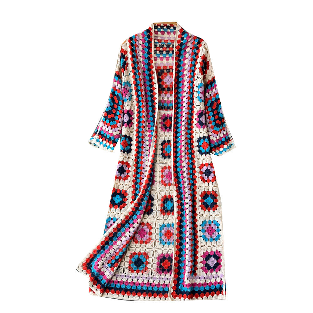 Colorful crochet cardigan with geometric pattern on a white background