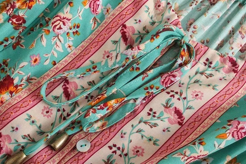 Floral fabric with a strap and button on a colorful background