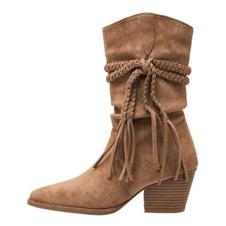 Brown suede boot with braided design on a white background
