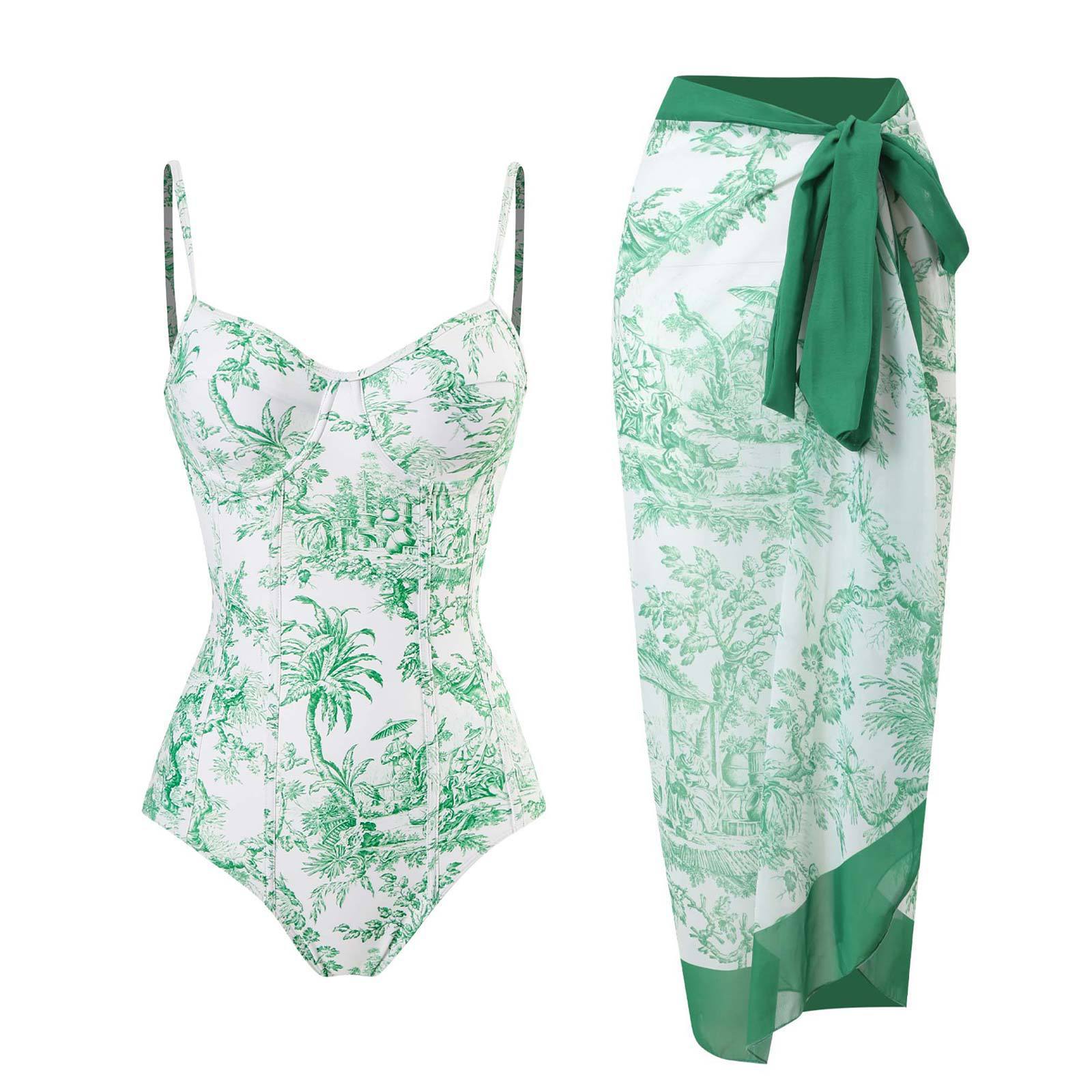 Green and white floral swimsuit with matching sarong on a white background