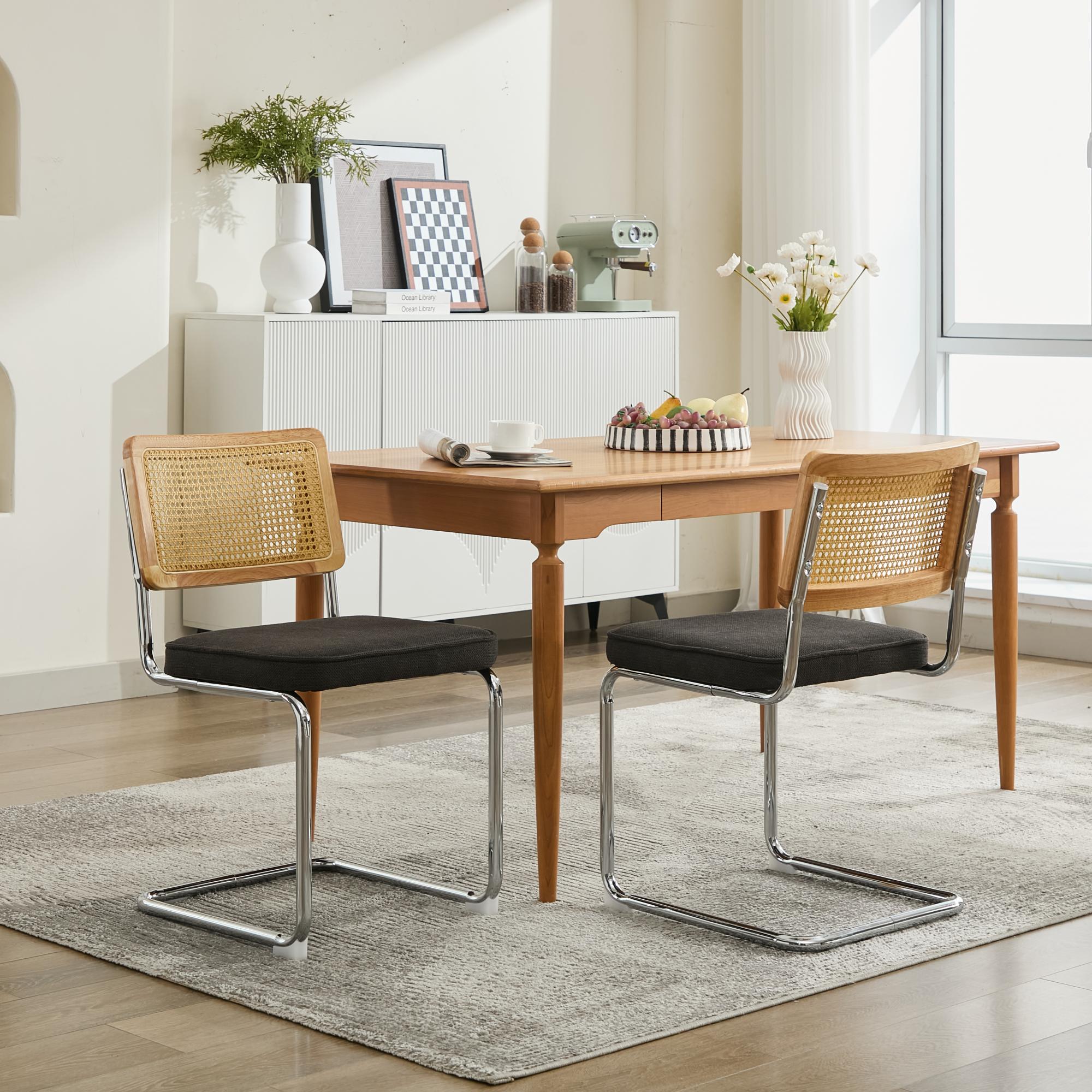 Dining room with wooden table and chairs on a rug