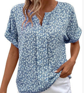 Blue floral blouse worn by a person with white pants