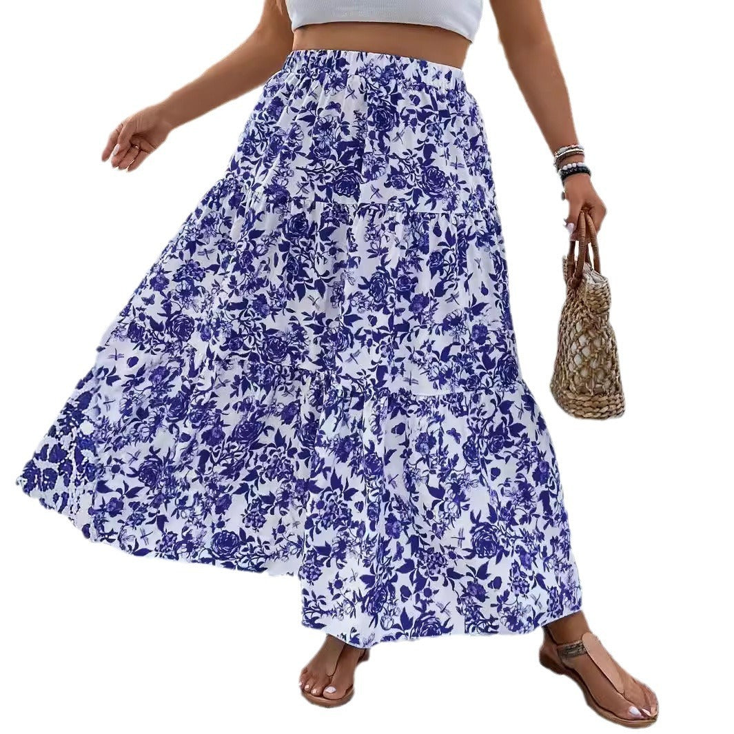Woman wearing a blue floral skirt on a white background