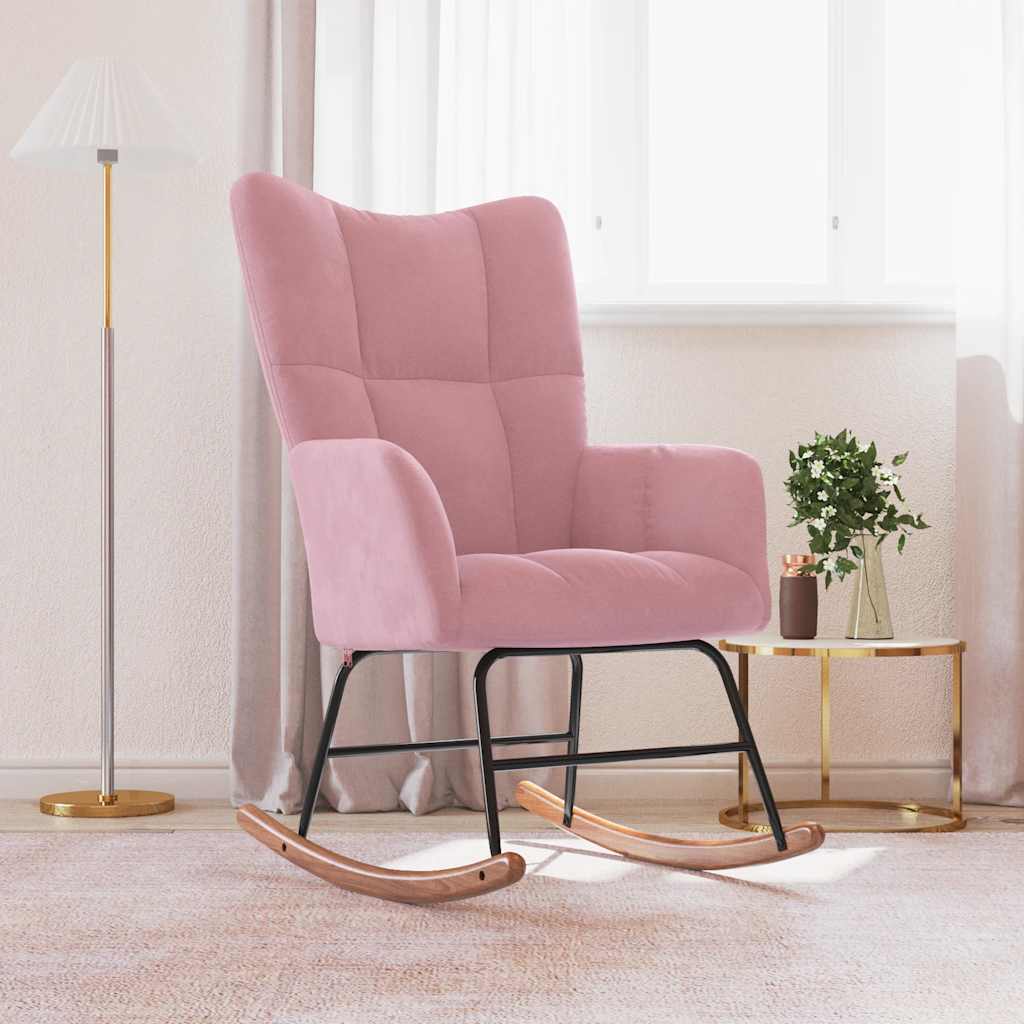 Pink rocking chair in a room with a lamp and small table with a plant.