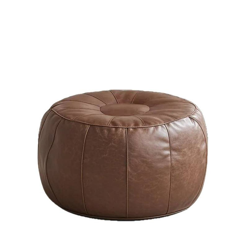 Brown leather ottoman on a white background