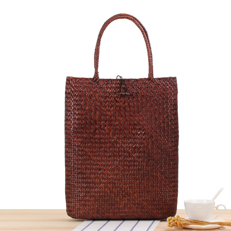 Brown woven tote bag on a white background