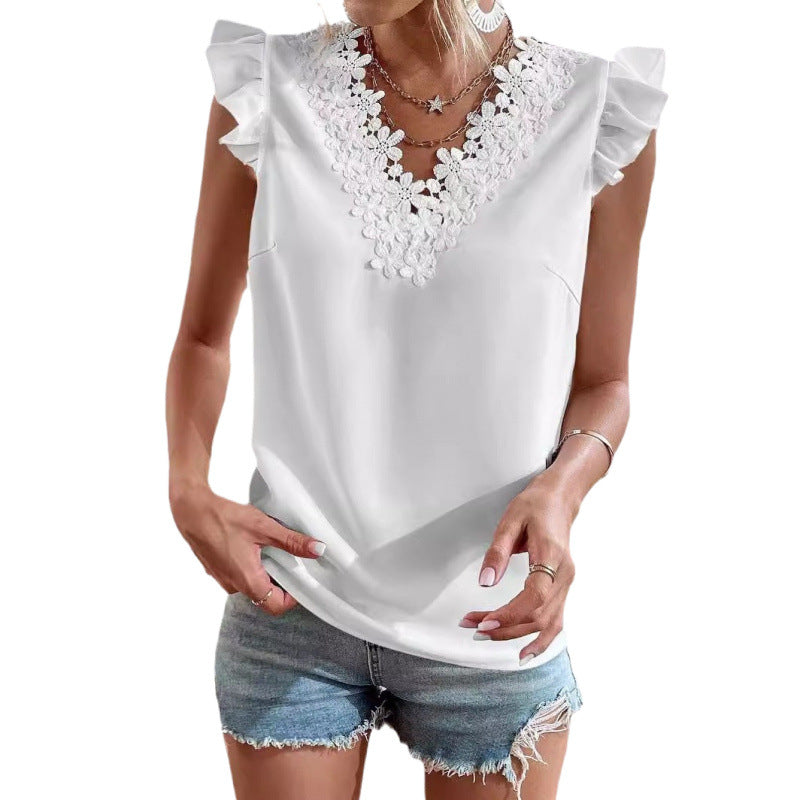 White sleeveless top with lace details worn by a person on a white background