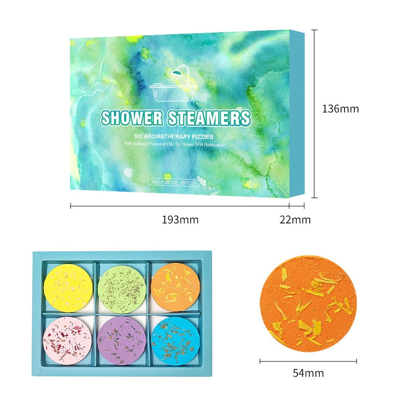 Box of shower steamers with colorful packaging, size measurements, and individual steamers shown.