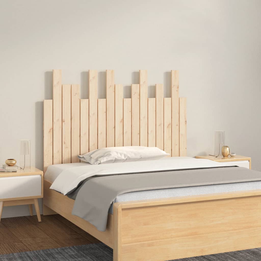 Wooden bed with geometric headboard in a minimalistic bedroom setting
