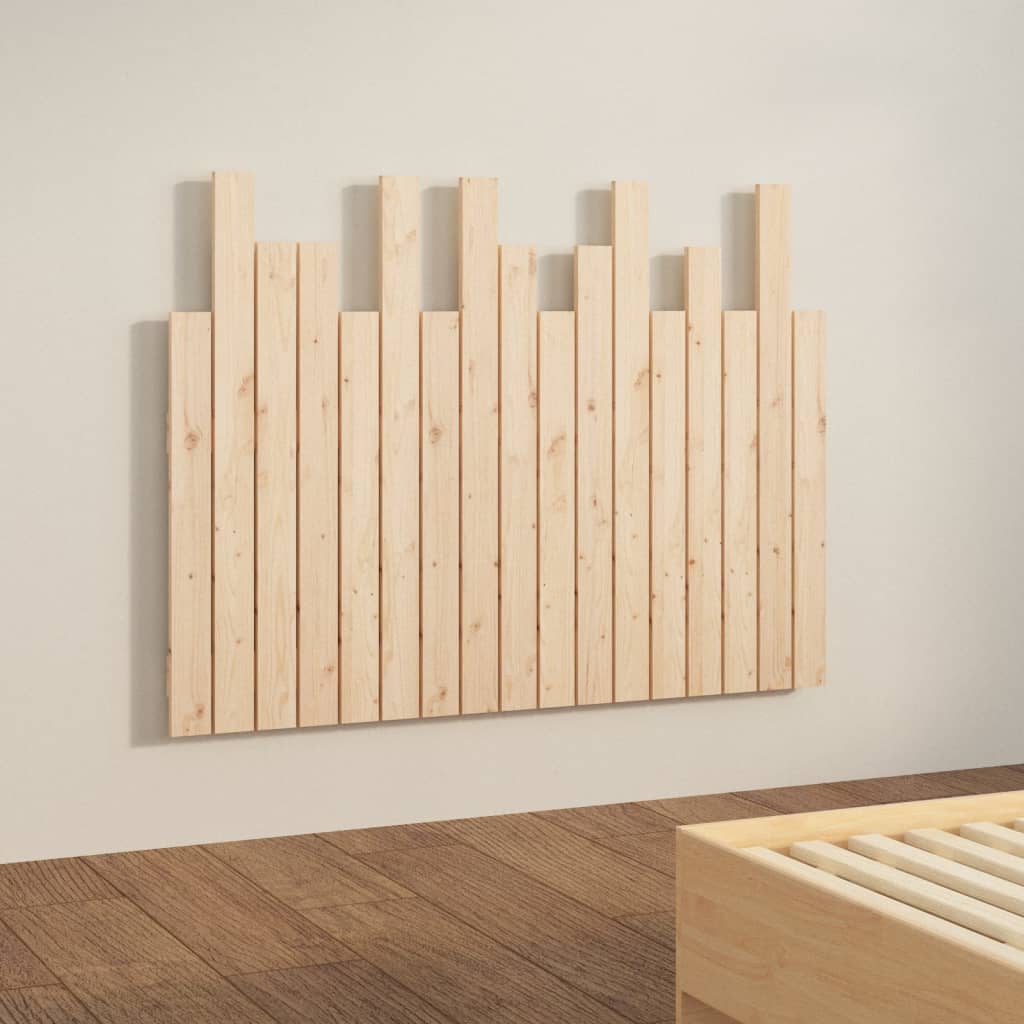 Wooden headboard with slatted design on a plain wall