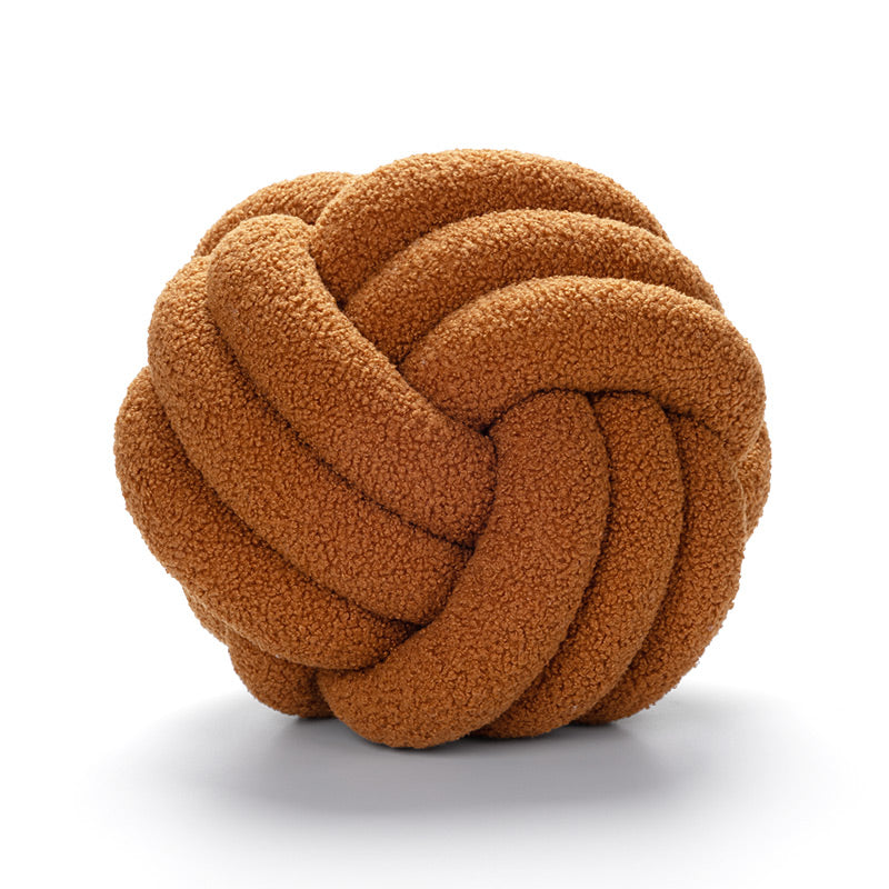 Brown knotted toy on a white background