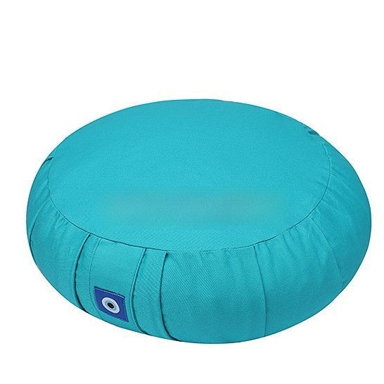 Round turquoise meditation cushion with a visible brand logo on a white background