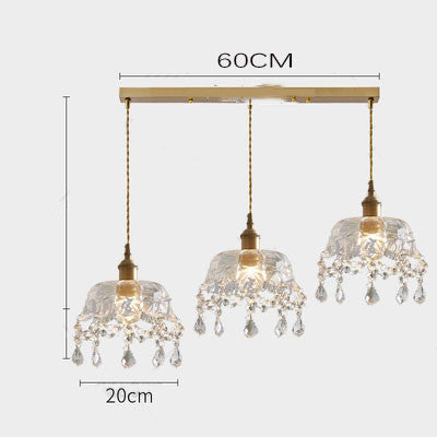 Chandelier with three crystal pendant lights and measurements on a white background
