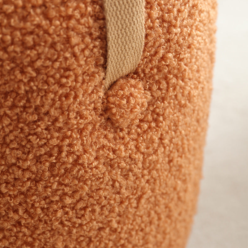 Close-up of a textured brown fabric with a white background
